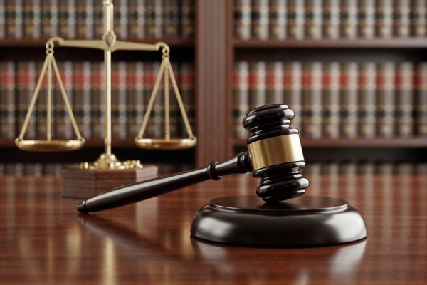 gavel-scales-justice-courtroom-setting gavel-scales-justice-courtroom-setting